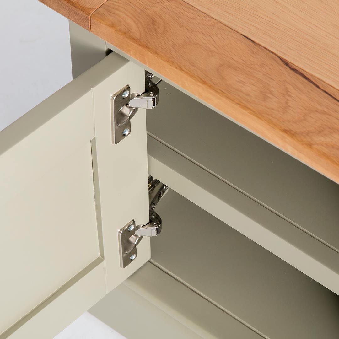 Close up of the cabinet door hinges on the Chichester Ledum Green Extra Large TV Unit