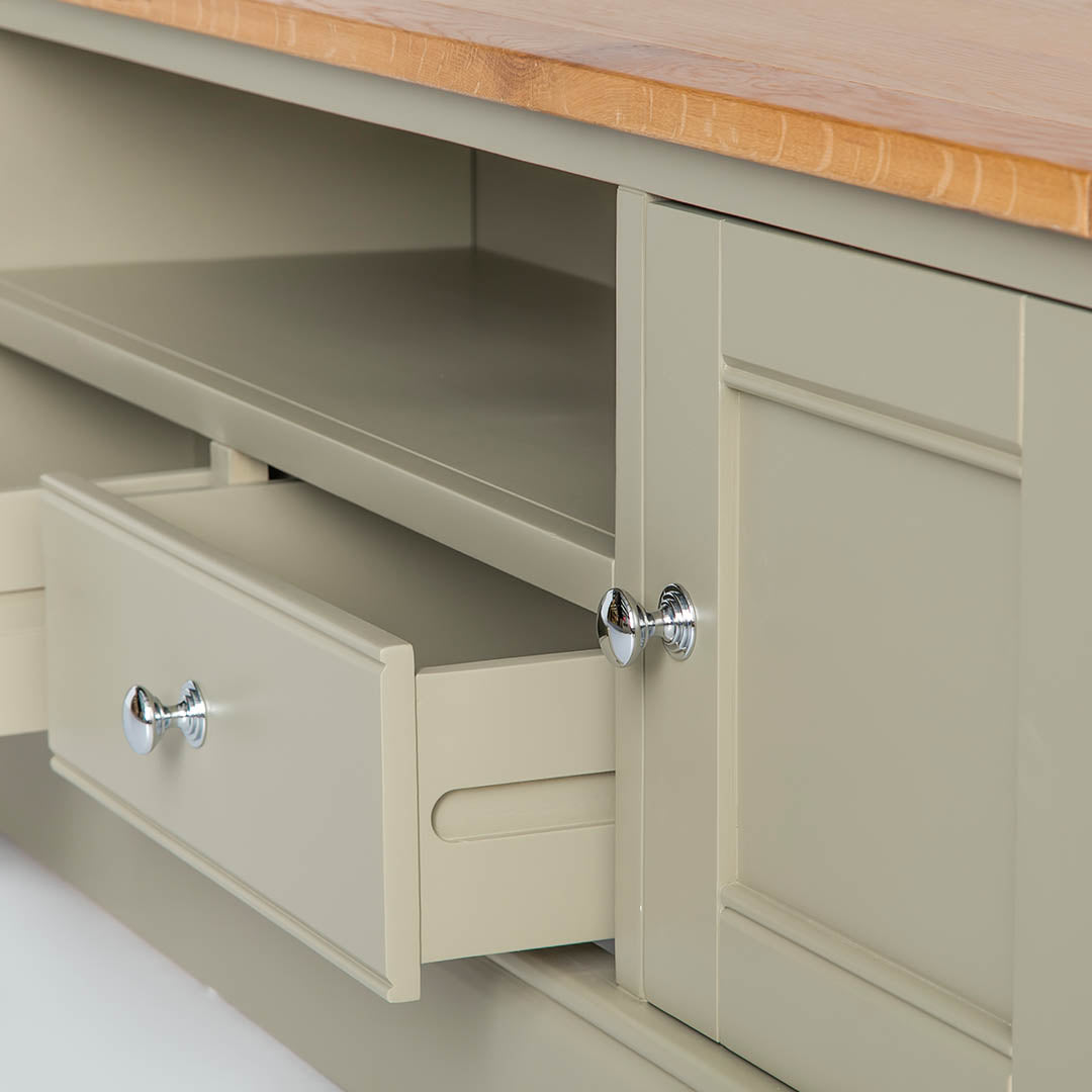Close up of the opened shelf on the Chichester Ledum Green Extra Large TV Unit