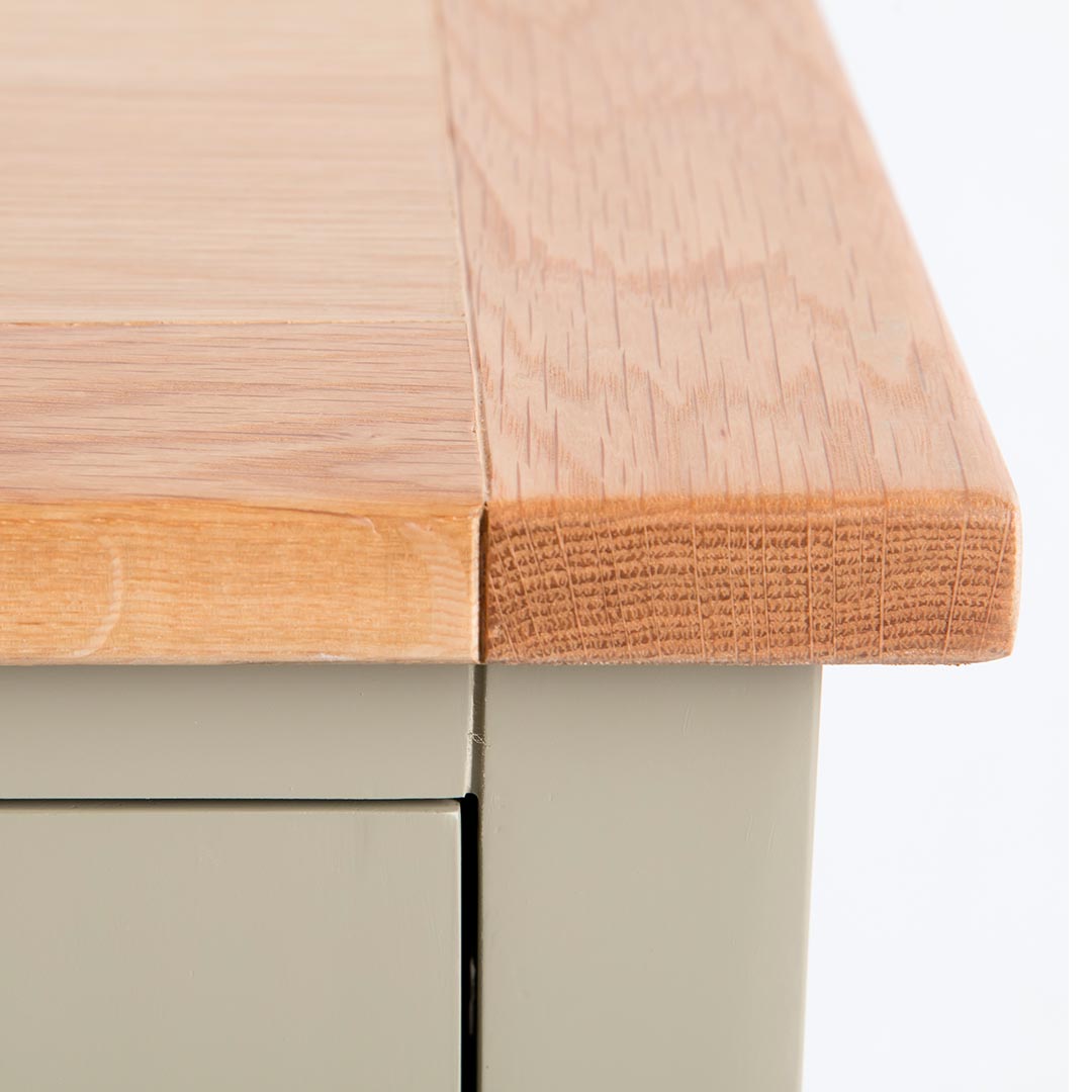 Close up of the oak top edge on the Chichester Ledum Green Extra Large TV Unit