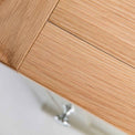 Close up of the oak top wood grain on the Chichester Ledum Green Mini Cupboard