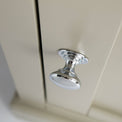 Close up of the round metal handle on the Chichester Ledum Green Mini Cupboard