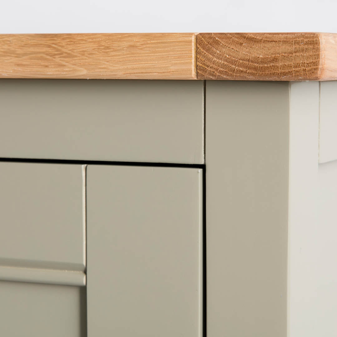 Close up of the oak top edge on the Chichester Ledum Green Mini Cupboard