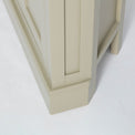 Side view of the plinth base on the Chichester Ledum Green Corner Cupboard