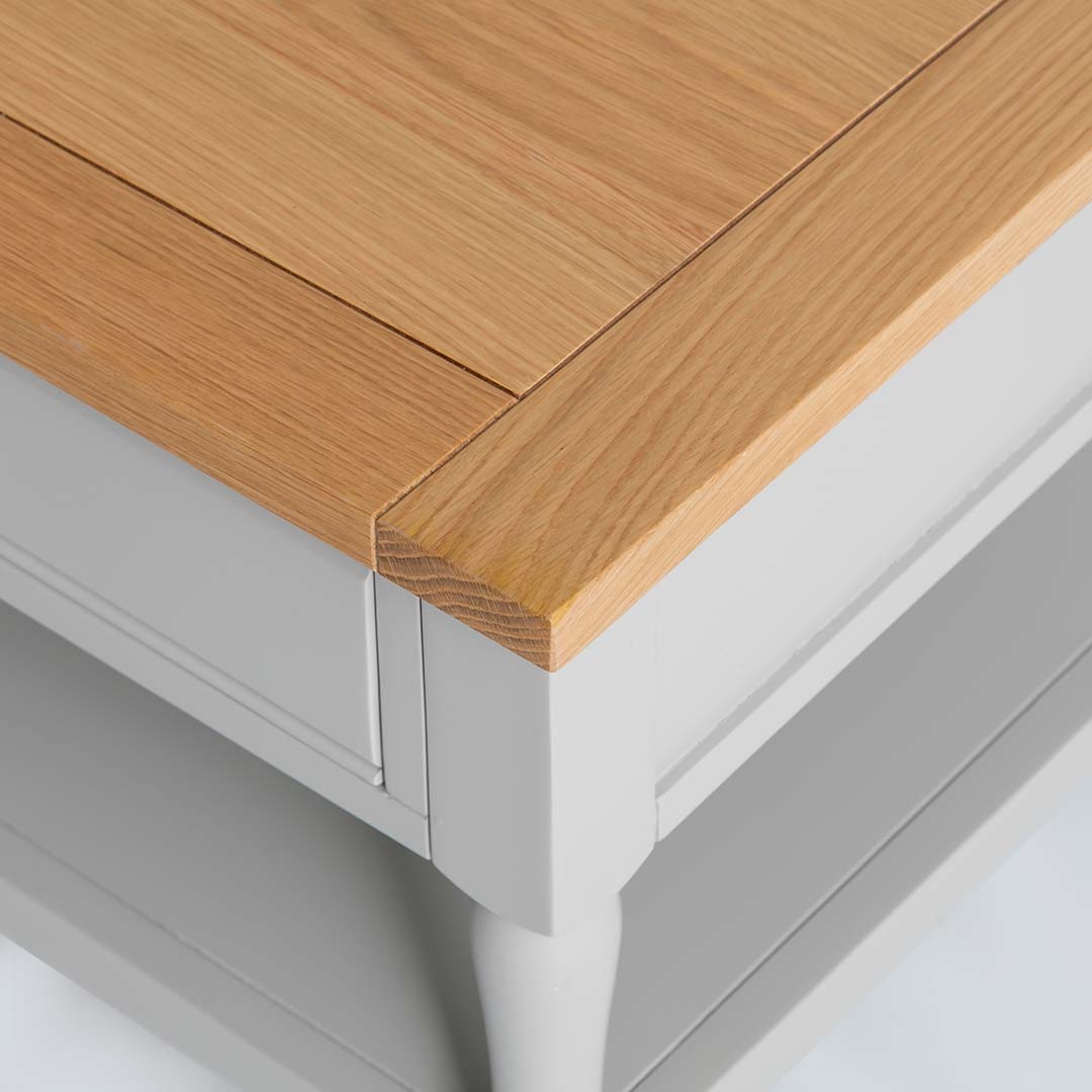 Close up of the painted grey wood frame on the Chichester Grey Coffee Table