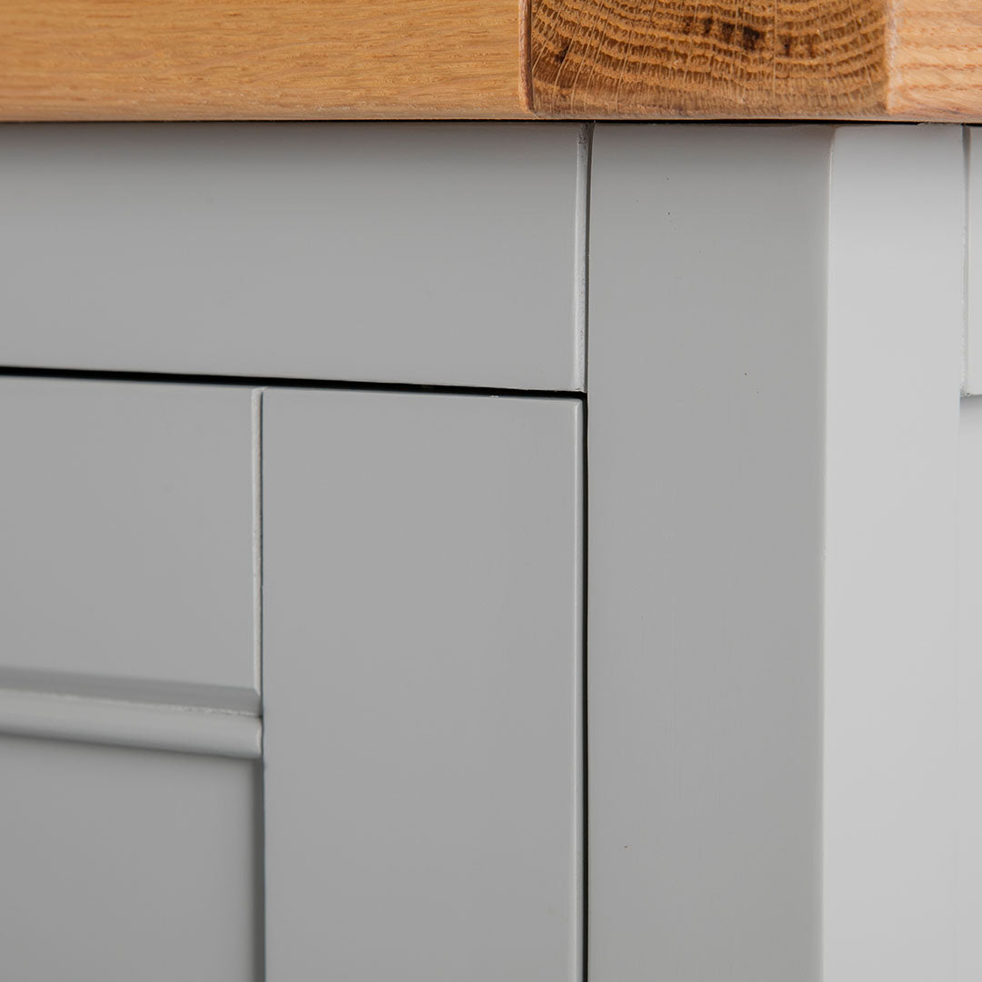 Close up of the painted grey solid wood frame on the Chichester Chester Grey Mini Cupboard