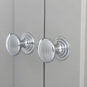 close up of the chrome handles on the Chichester Grey Corner Cupboard