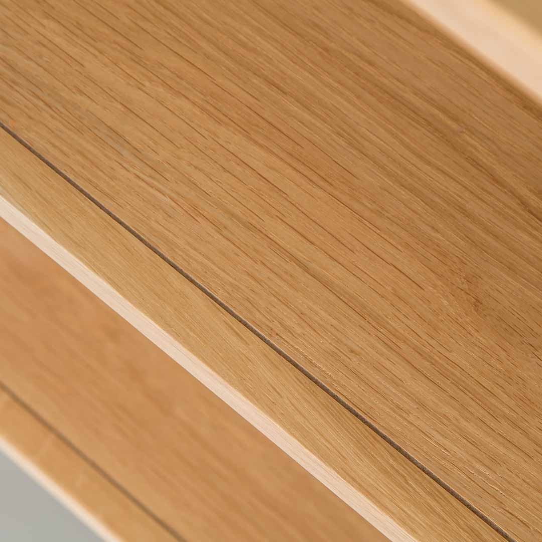 Close up of the oak veneer wood grain on the Chichester Chester Grey Low Bookcase
