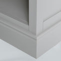 Close up of the grey painted plinth base on the Chichester Chester Grey Low Bookcase