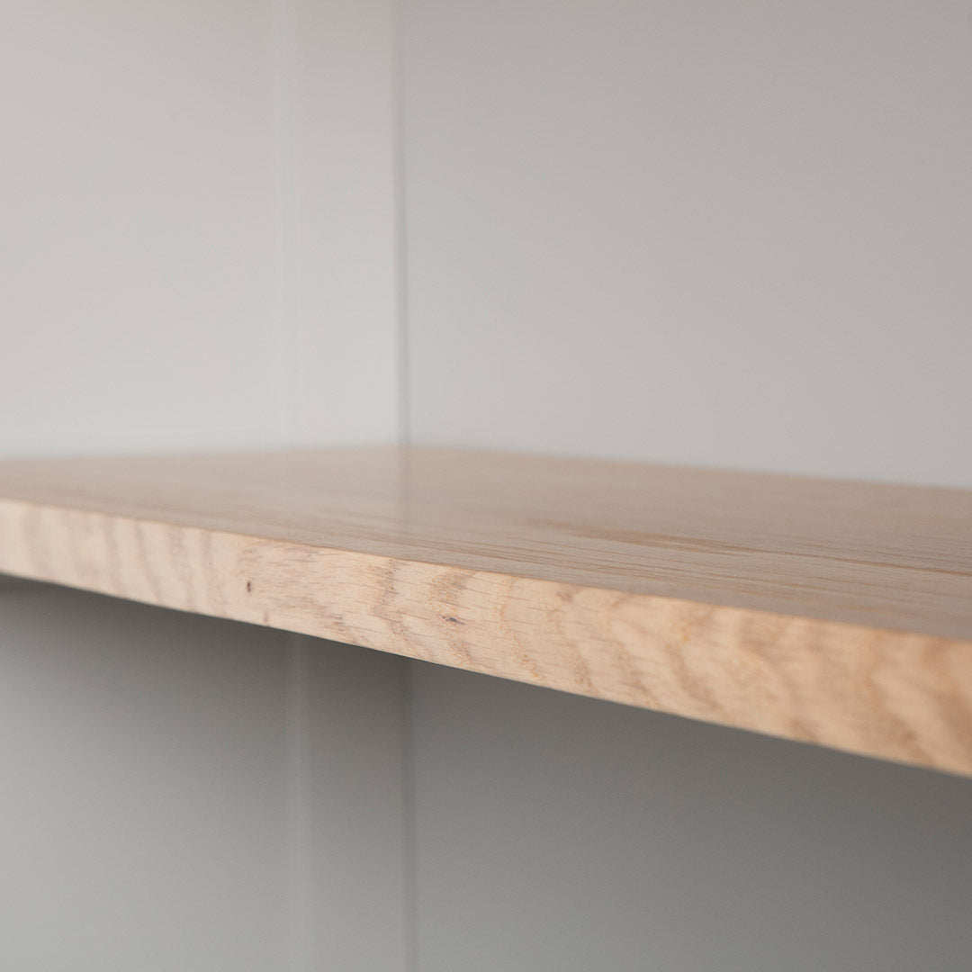 Close up of the oak fixed shelf edge on the Chichester Chester Grey Low Bookcase
