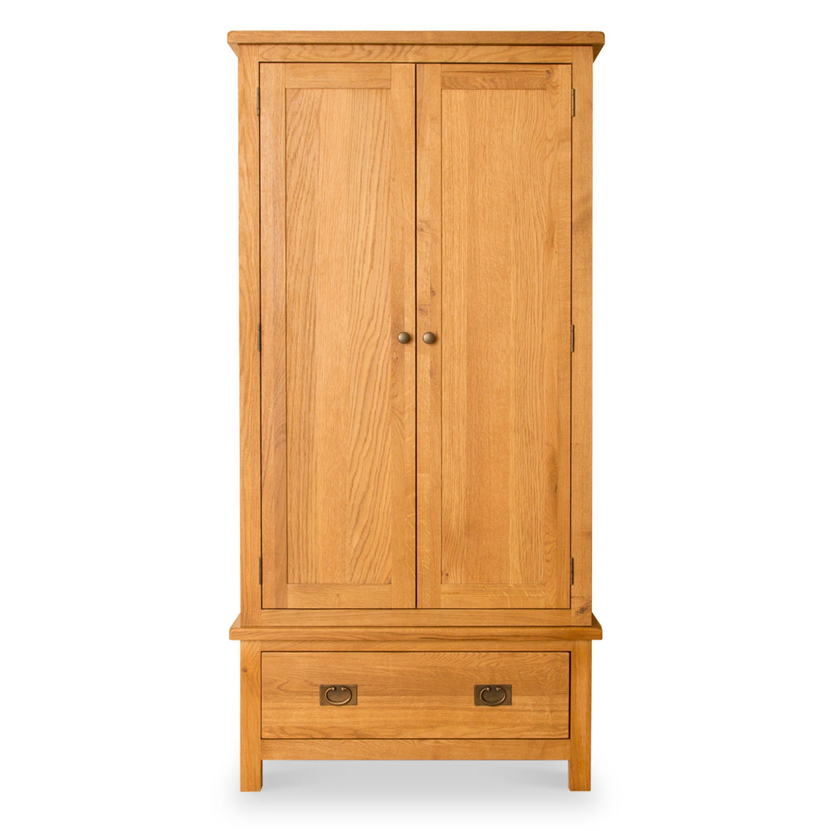 A wooden wardrobe stands closed against a white background, with one drawer at the bottom, and two round handles on the doors.