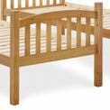 close up of the curved slatted footboard on the Liberty Pine Detachable Bunk Bed