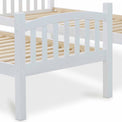 close up of the curved slatted footboard on the Liberty White Detachable Bunk Beds