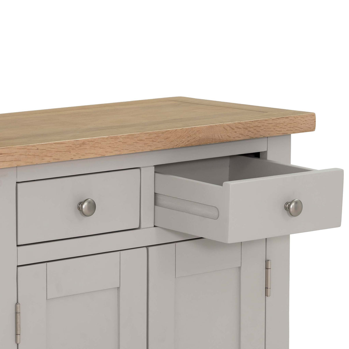 Close up of oak top and open drawer with wooden runners for Charlestown Grey Small Sideboard from Roseland Furniture
