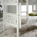 close up of the painted white frame on the Carlson White Detachable Single Bunk Beds