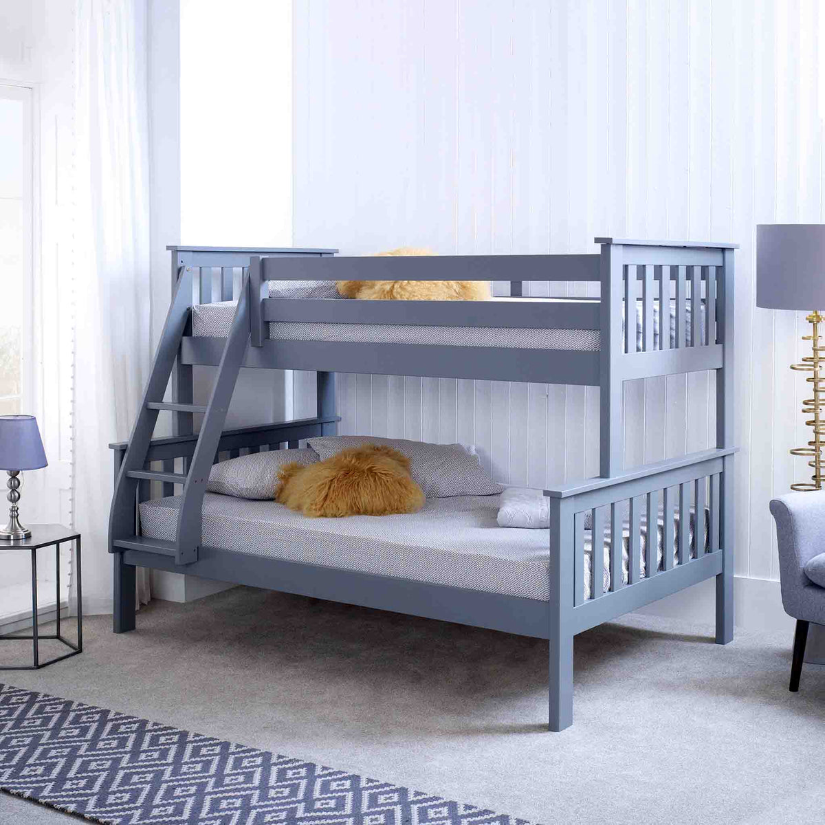 lifestyle image of the Carlson Grey Triple Sleeper Bunk Bed