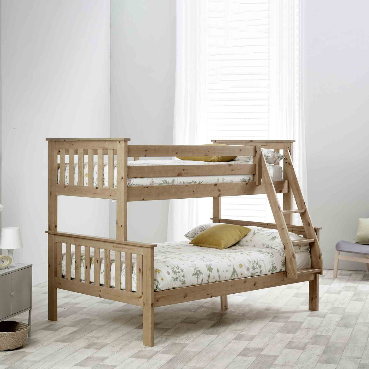 lifestyle image of the Carlson Pine Triple Sleeper Bunk Bed