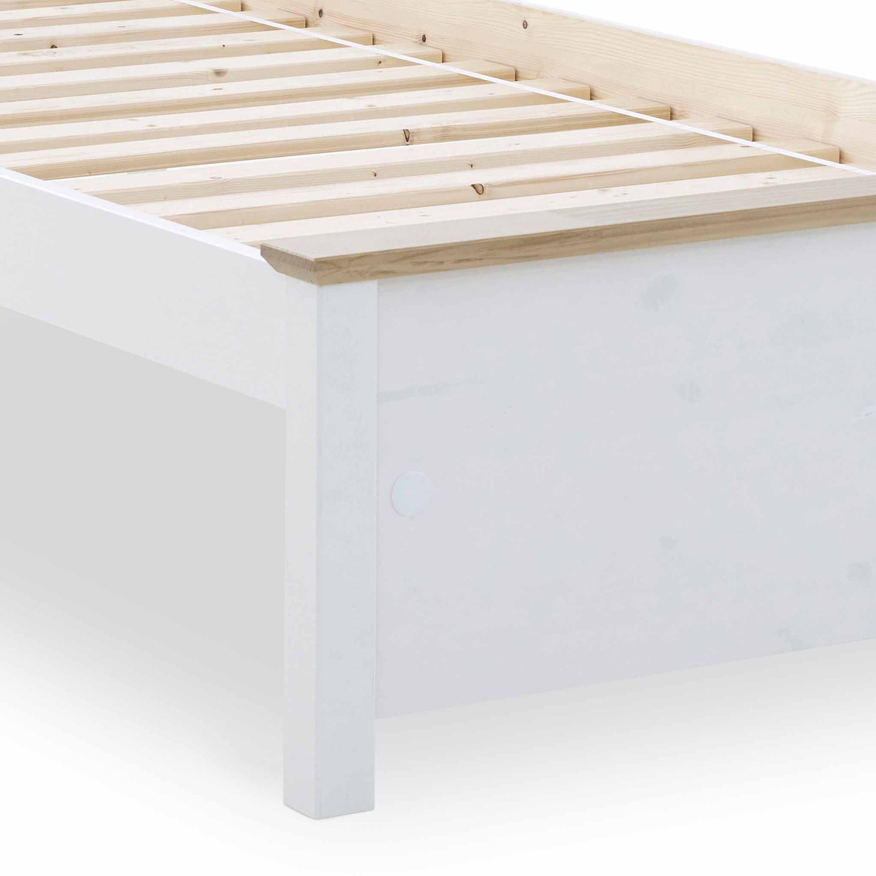A white wooden bed frame partially shown with slats on top, against a white background.
