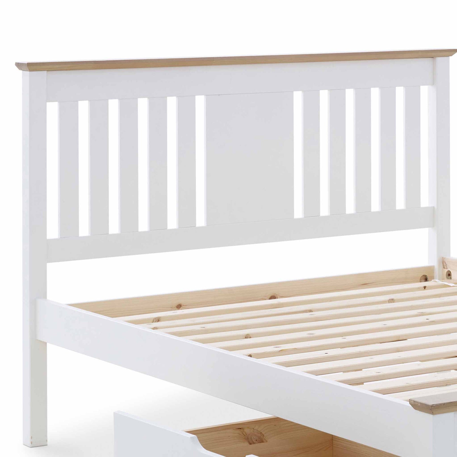 A white wooden bed frame with slatted base, partially assembled, isolated on a white background.