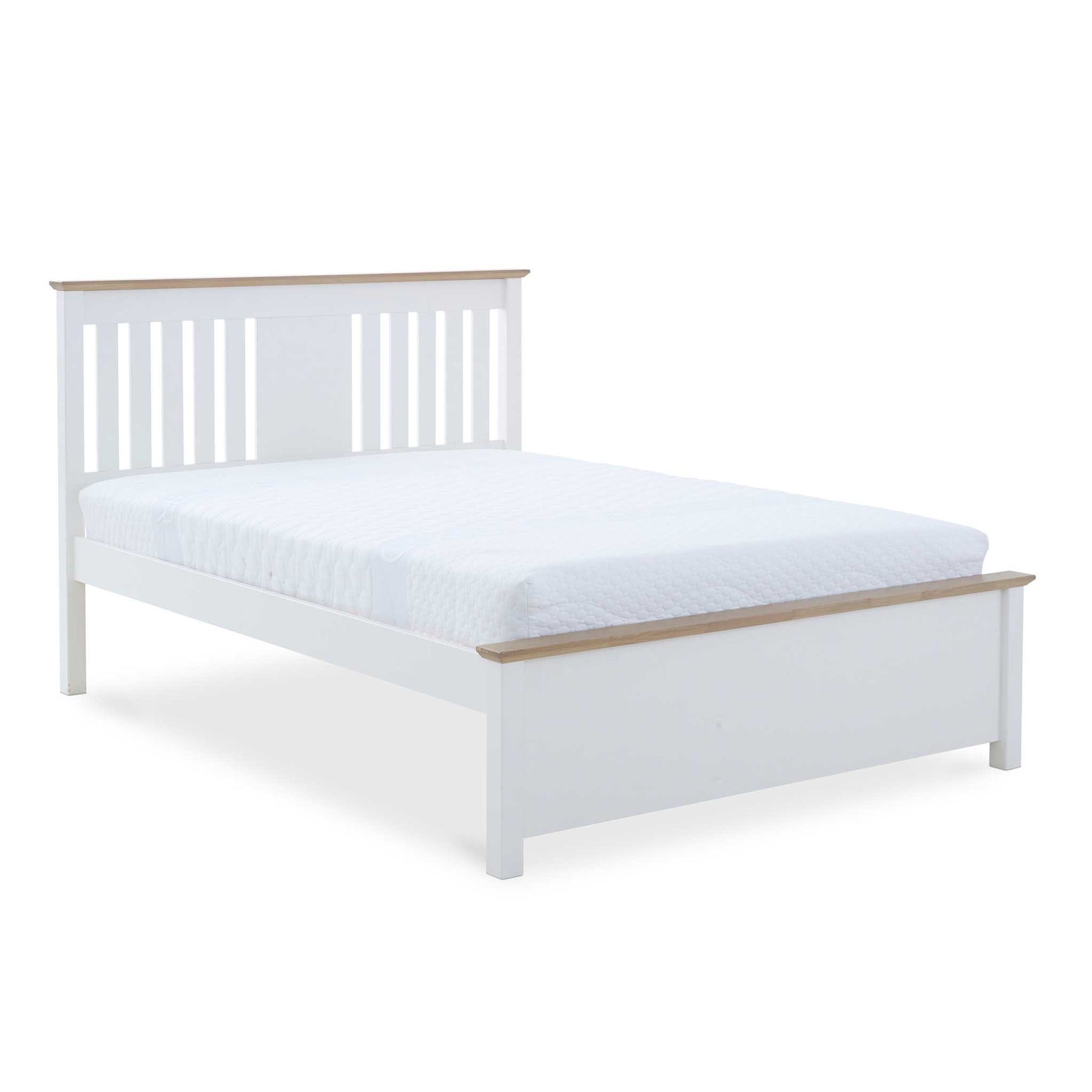 A white wooden bed frame with slatted headboard supports a mattress, against a stark white background.