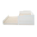 side view of the close up of the white painted wooden frame on the Snooze White Wooden Bed with opened Trundle 
