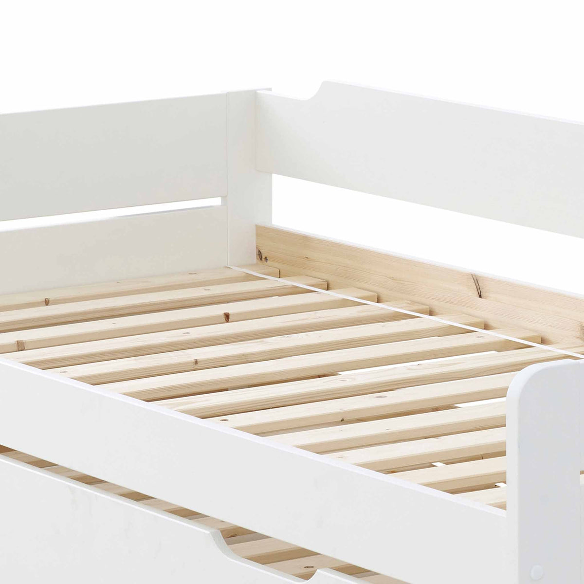 close up of the pine slats on the close up of the white painted wooden frame on the Snooze White Wooden Bed with Trundle 