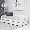 Lifestyle image of the close up of the white painted wooden frame on the Snooze White Wooden Bed with Trundle 