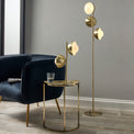 Estelle Brushed Brass Metal and White Orb Dome Floor Lamp with lights on