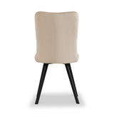 A beige upholstered dining chair with a curved backrest stands on black angular legs against a solid white background.