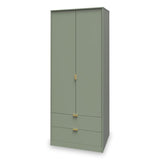 A tall green wardrobe with two doors above and two drawers below, featuring golden handles, stands against a plain white background.
