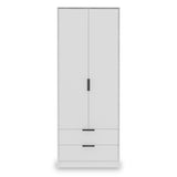 A tall, white freestanding wardrobe with two doors above and two drawers below, against a plain background.