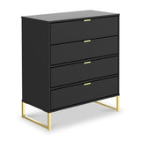 A black four-drawer dresser with gold handles stands against a white background, elevated on a minimalist gold metal frame.