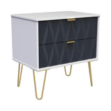A modern white sideboard with textured dark gray doors and gold handles stands on slender, gold-colored metal legs in a neutral space.