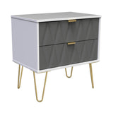 A modern gray and white dresser with geometric patterned drawers and brass handles stands on slender gold-colored metal legs, isolated against a white background.