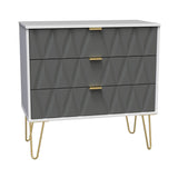 A modern dresser with geometric-patterned gray drawers, gold handles, and slender gold legs stands against a white background.