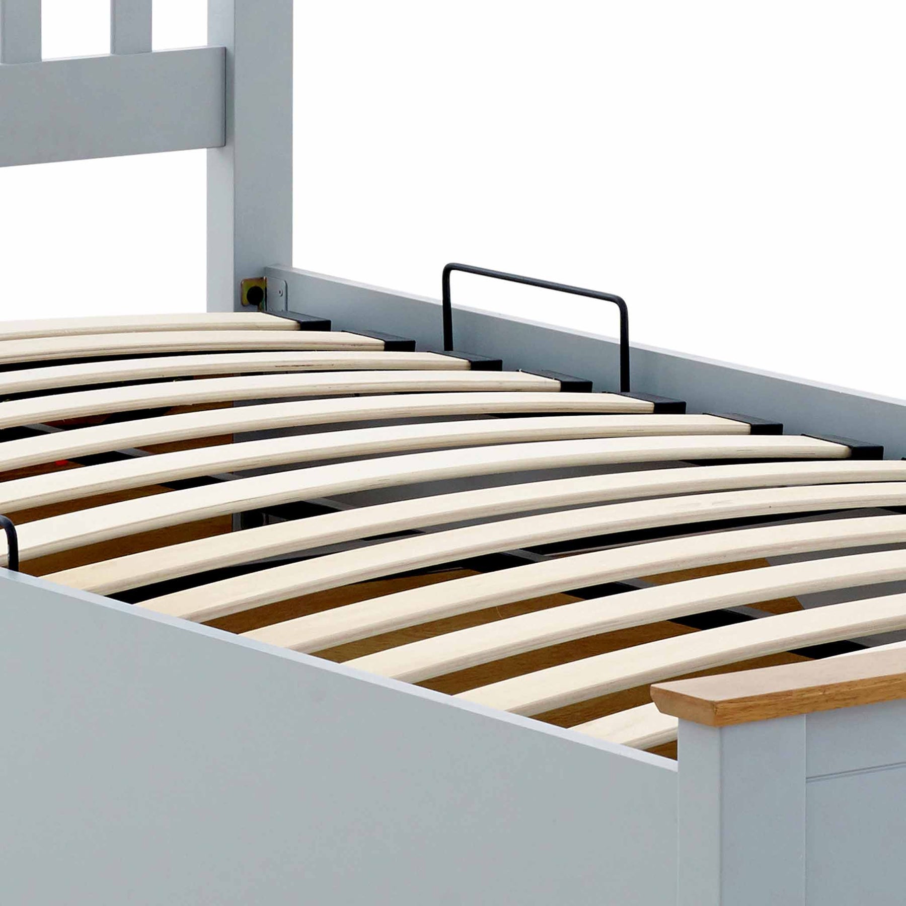 close up of the curved pine slats on the Atlas Grey Single Wooden Ottoman Bed