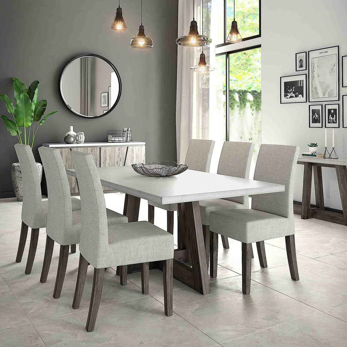 Lifestyle image of the Saltaire Grey Upholstered Fabric Dining Chair with large dining table