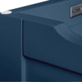 A close-up of a dark blue, smooth object with a curved shape and a silver rectangular emblem.