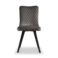 A gray upholstered dining chair with a quilted backrest and black wooden legs is positioned front and center against a white background.
