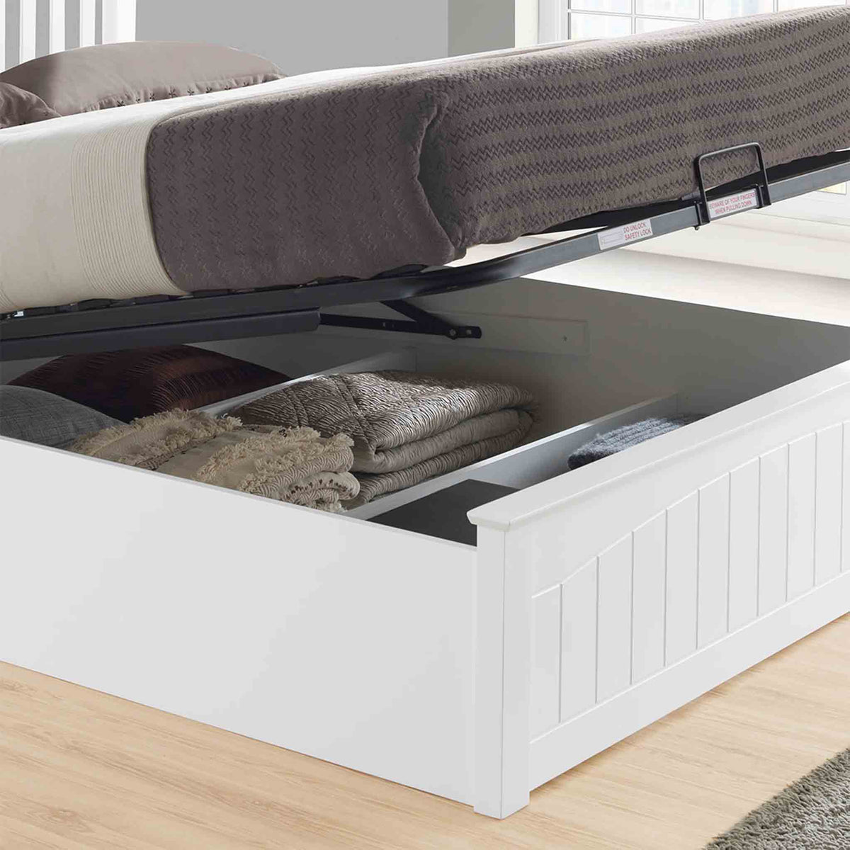 lifestyle image of the under bed storage on the Chiltern White Ottoman Storage Bed