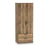 A wooden wardrobe stands isolated with doors closed and two drawers at the bottom, set against a white background.