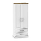 A freestanding white wardrobe with a wooden top, featuring two doors above two drawers, set against an isolated background.