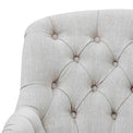 close up of the button tuft upholstered fabric on the Cream Linen Fabric Bianca Armchair