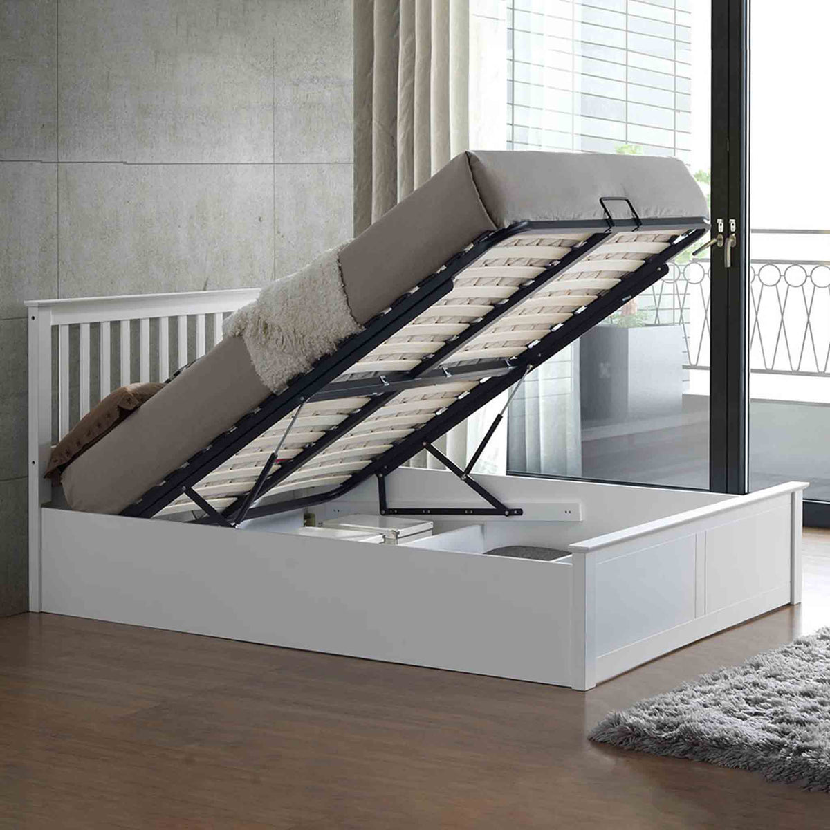 lifestyle image of the  Trent White Wooden Ottoman Bed with under bed storage