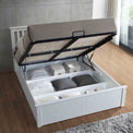 lifestyle shot of the under bed storage on the  Trent White Wooden Ottoman Bed 