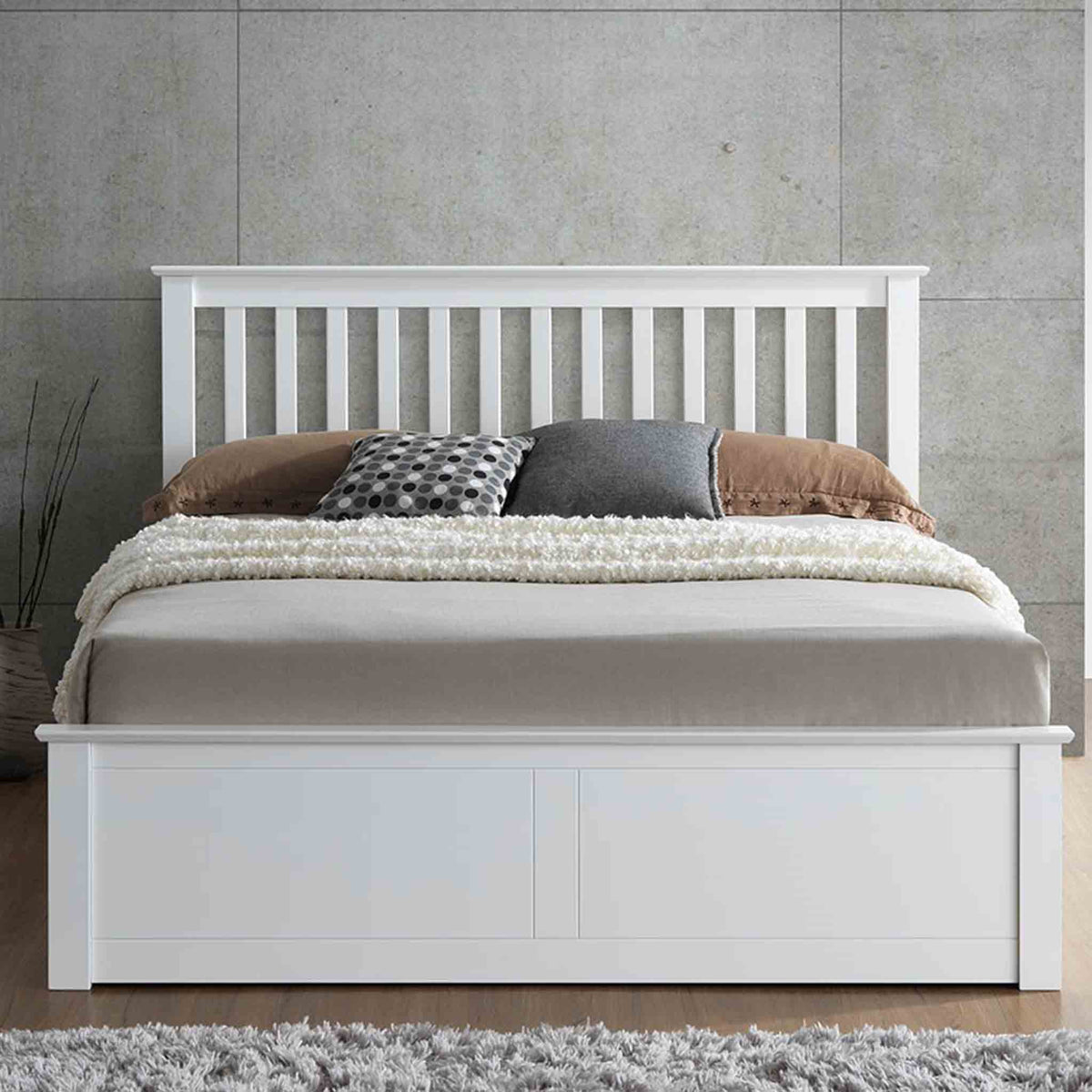 lifestyle front view image of the  Trent White Wooden Ottoman Bed 