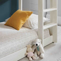 close up of the bottom bed on the Trio White 3 Sleeper Wooden Bunk Bed