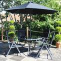 Rio Reclining 4 Seat Garden Dining Set with Parasol Lifestyle Setting