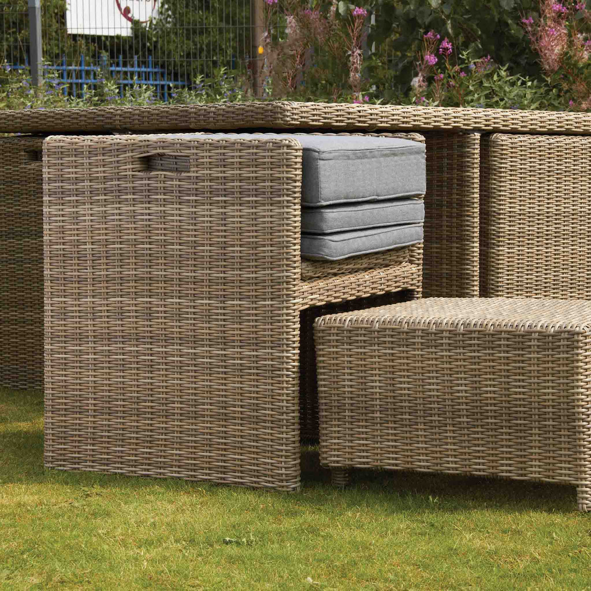 Wentworth 8 Seat Deluxe Rattan Cube Garden Dining Set - Chair being packed away for going under table
