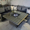 Wentworth Rattan 120cm Fire Pit Garden Dining Table & Lounge Set - close up of lit fire pit table