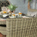 Wentworth 140cm 6 Seater Rattan Round Garden Dining Set Lifestyle close up of rattan chair